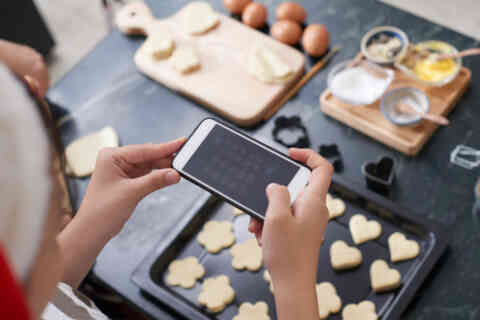 Woman Taking Photo Of Cookies 1048238330 1256x838