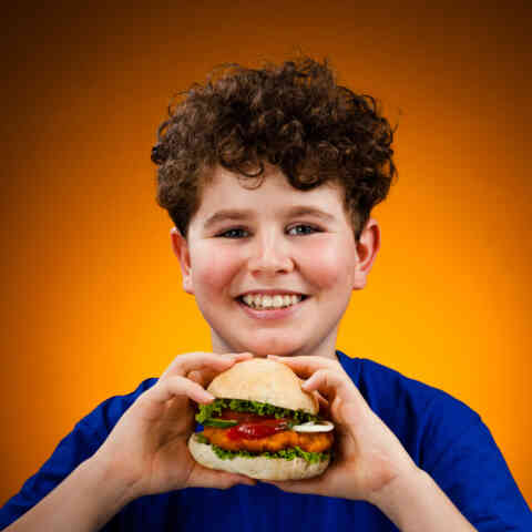 Boy eating hamburger 139513862 1025x1025