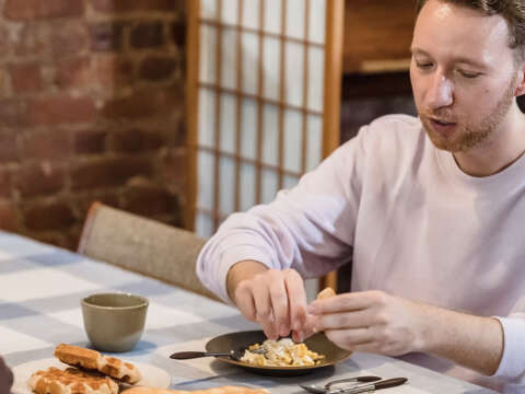 Men eating waffles